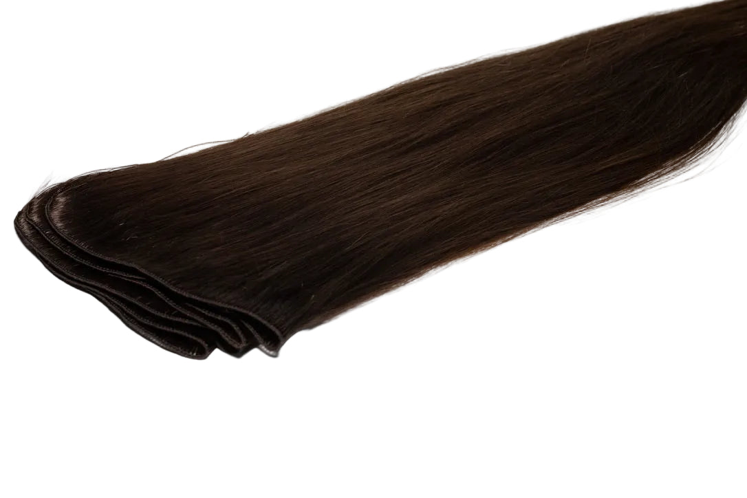 Dark brown hair extensions on a white background
